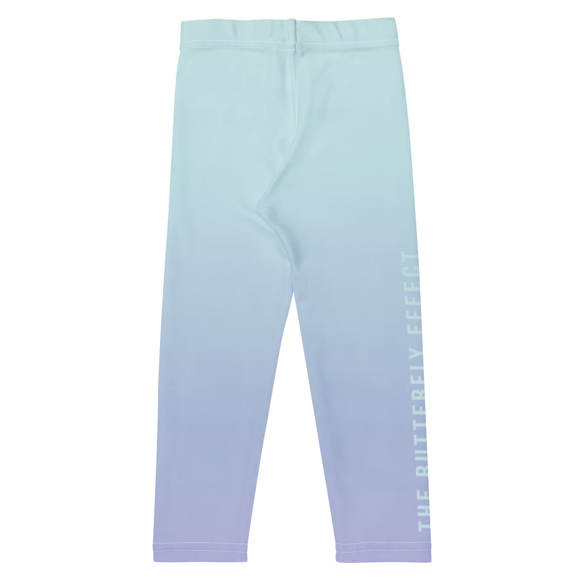 A pair of children's leggings with a vertical ombre gradient transitioning from light mint green at the top to soft lavender at the bottom, featuring 'THE BUTTERFLY EFFECT' printed vertically in white on the lower right leg.