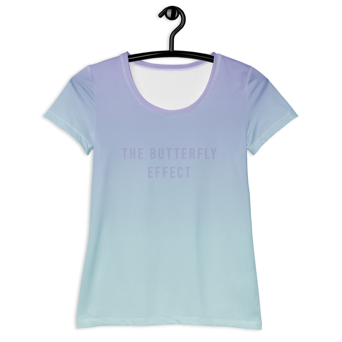 A short-sleeve scoop-neck t-shirt hanging on a black hanger against a white background, featuring a smooth vertical gradient from light lavender purple at the top to pale icy blue at the bottom, with the text 'THE BUTTERFLY EFFECT' printed in a matching light purple font on the chest.
