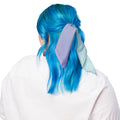 A person shown from the back wearing a white top, with bright blue hair and a lavender satin hair tie or scarf tied around the hair against a plain white background.
