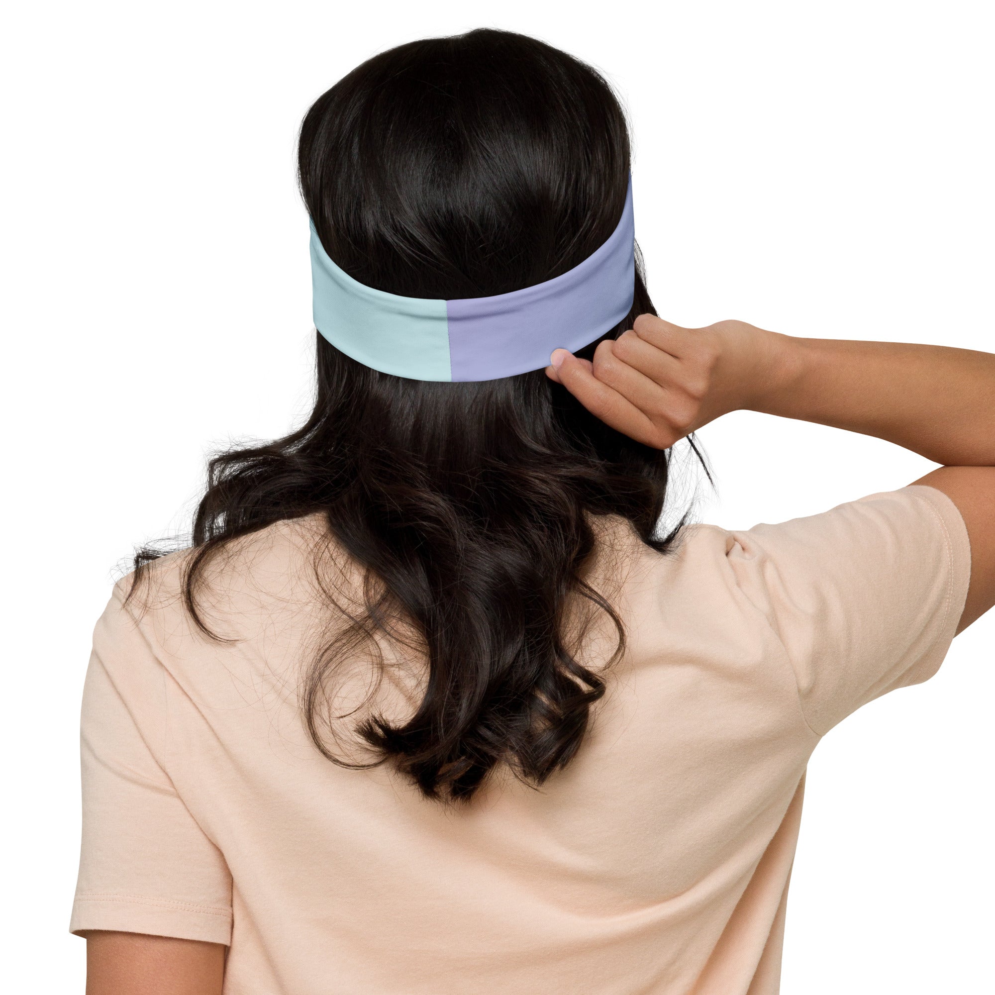 Person wearing a white visor on a plain background