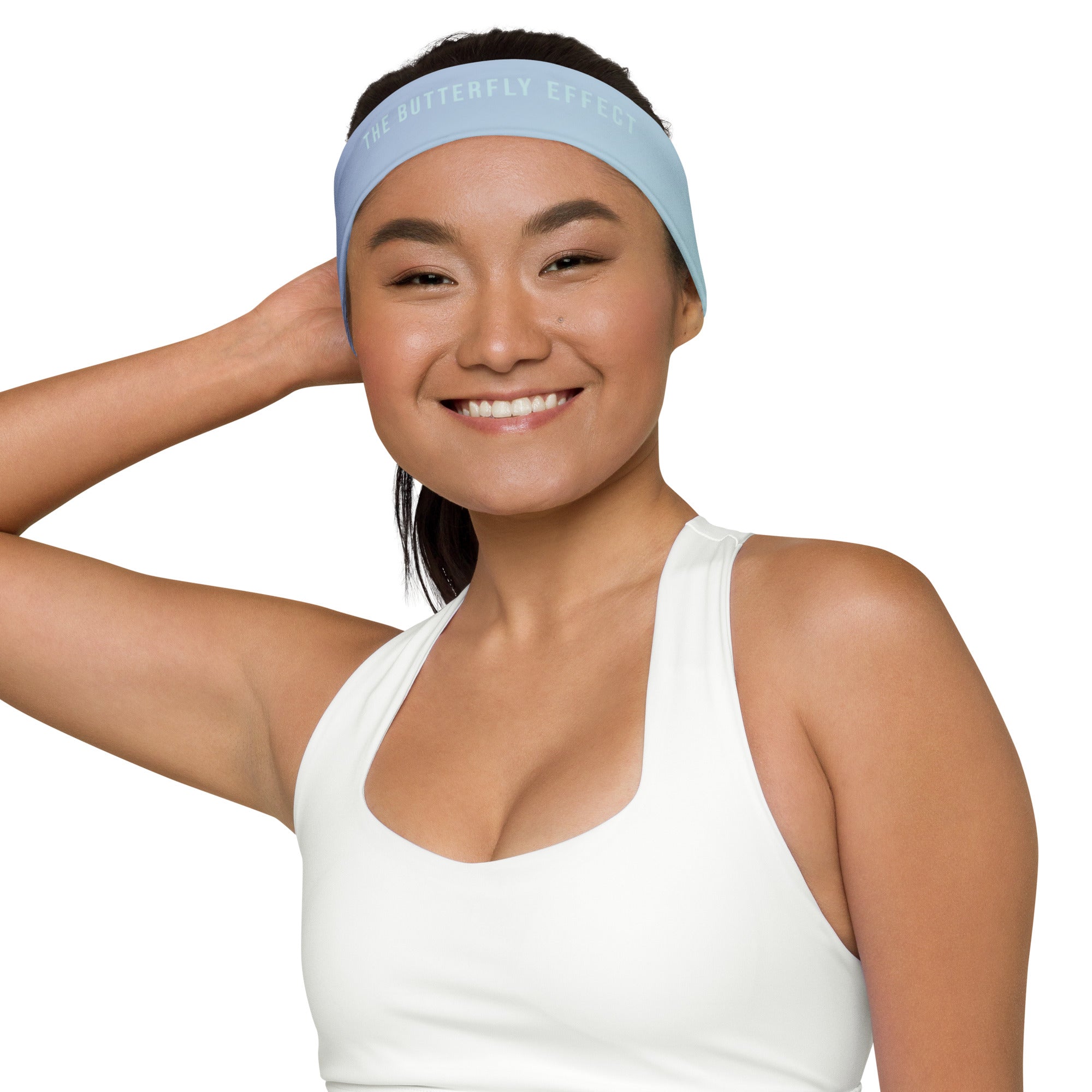 Woman wearing a white tank top and headband with text on a white background
