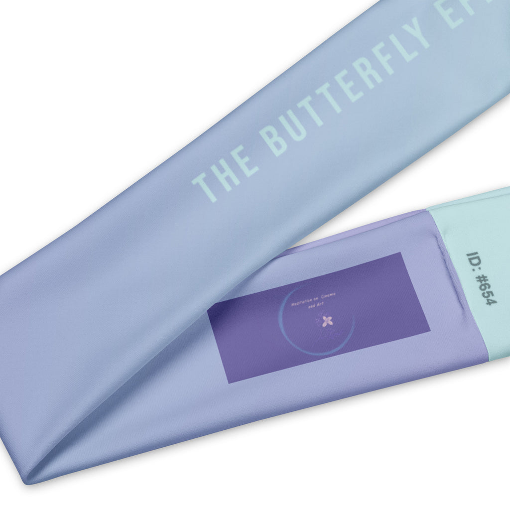 A close-up of a light blue fabric item printed with the words 'THE BUTTERFLY EP.