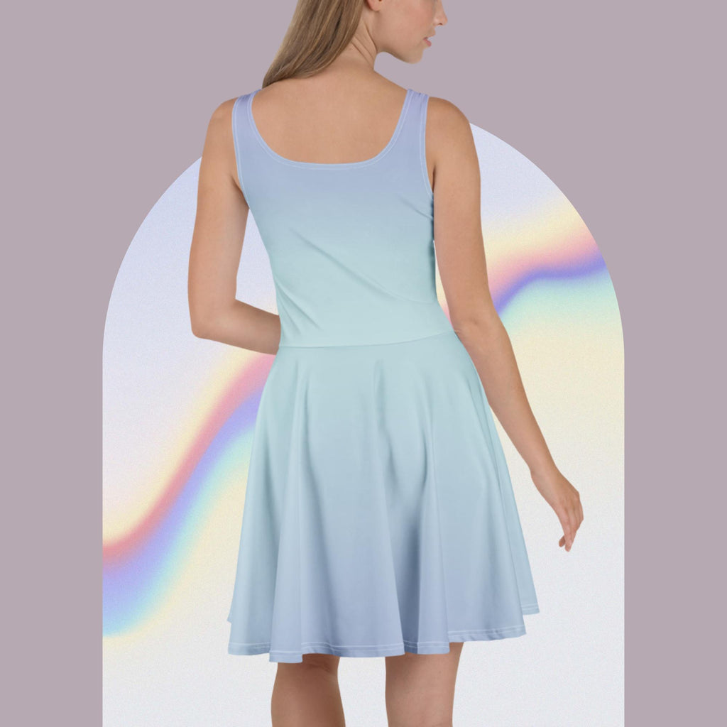 A woman shown from the back wearing a sleeveless light blue fit-and-flare dress, posed against a pastel lavender background with an arched rainbow graphic behind her.