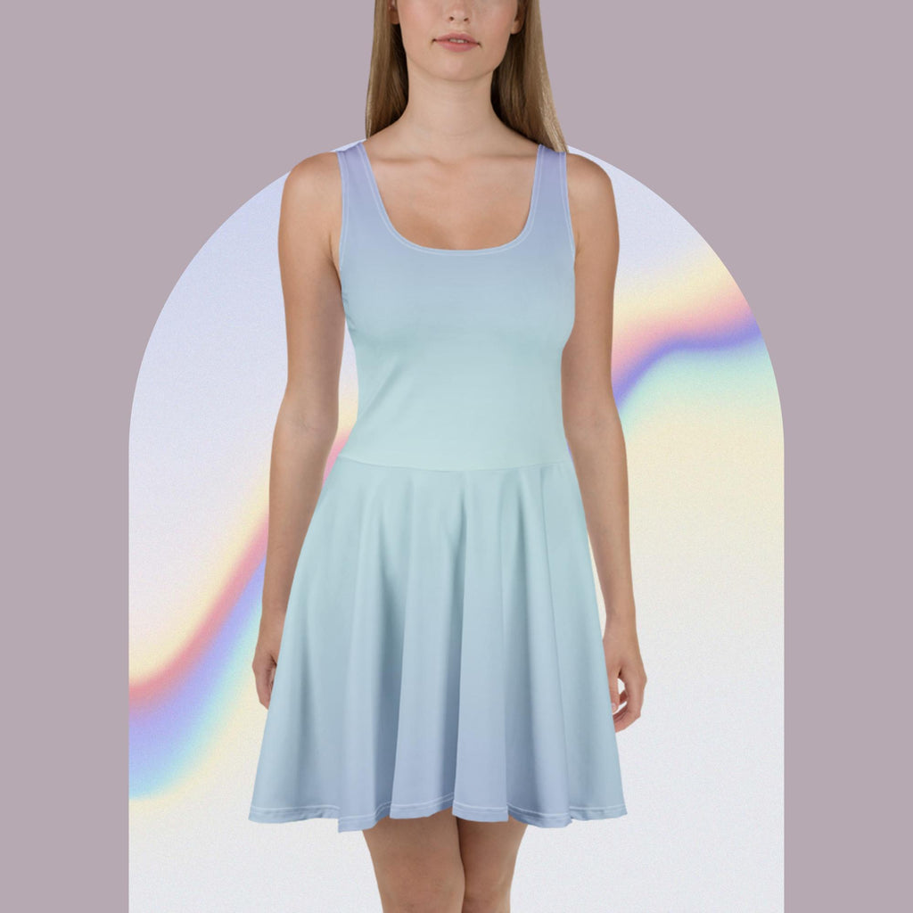 A woman modeling a sleeveless light blue scoop-neck skater dress against a pale lavender background with a white arched frame and soft rainbow gradient accents.