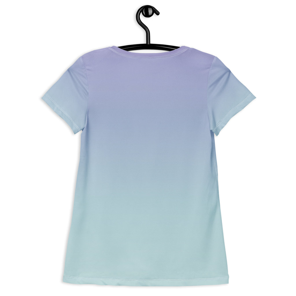 A short-sleeve crewneck t-shirt with a smooth vertical gradient transitioning from light lavender purple at the top to pale icy blue at the bottom, hanging on a black hanger against a plain white background.