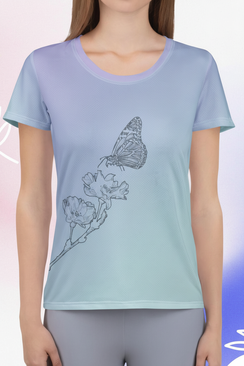A woman wearing a short-sleeve athletic t-shirt with a light blue to lavender gradient and a black line art butterfly and flower graphic on the front.