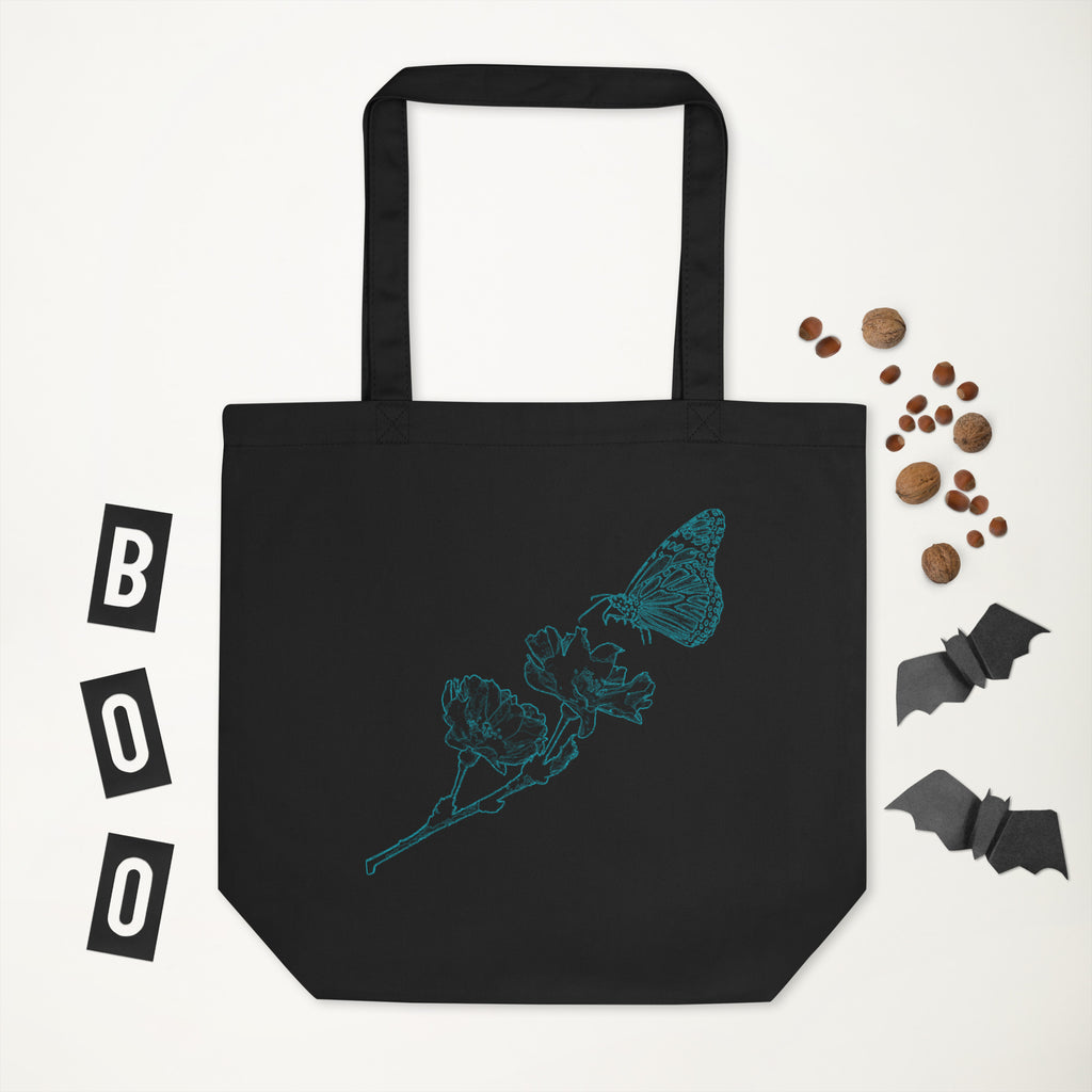 Black tote bag with 'Directed by Amanda' text, surrounded by Halloween decorations on a white background.