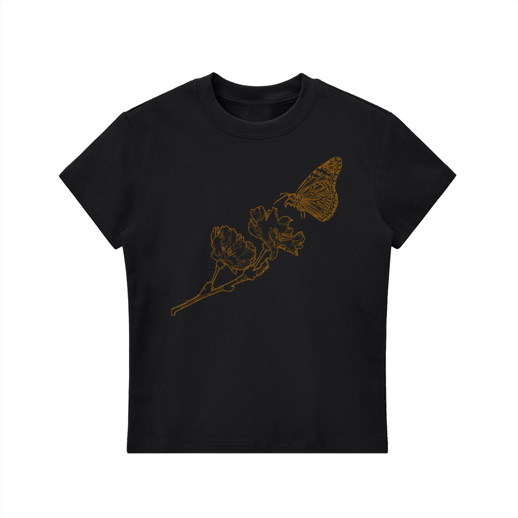A black short-sleeve crewneck t-shirt featuring a gold line art graphic of a butterfly perched on a flower branch across the chest, displayed on a solid white background.